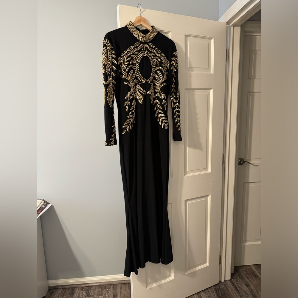 Gorgeous black custom made dress hand beaded gold beads.